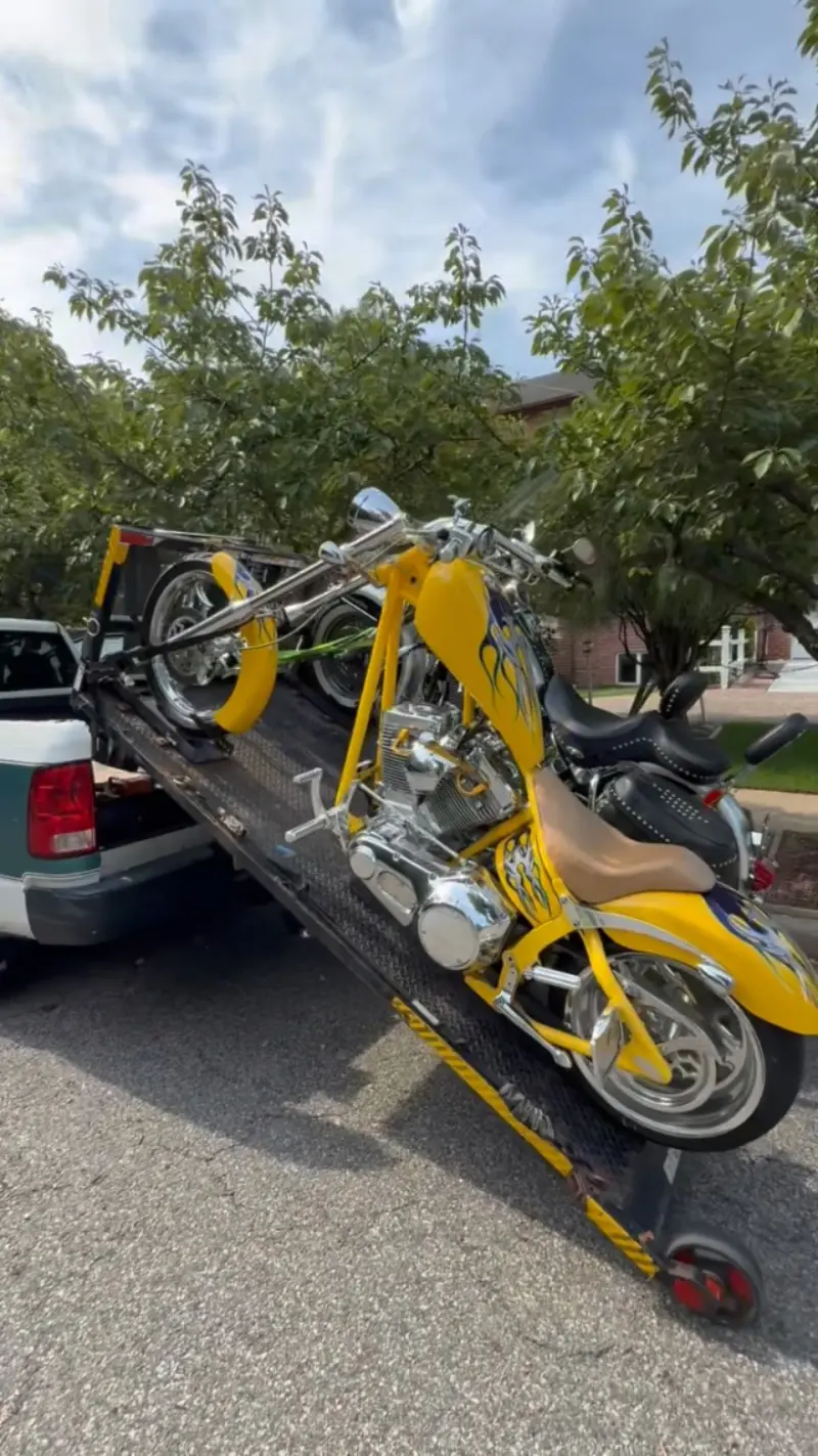 Motorcycle being loaded onto our pickup truck